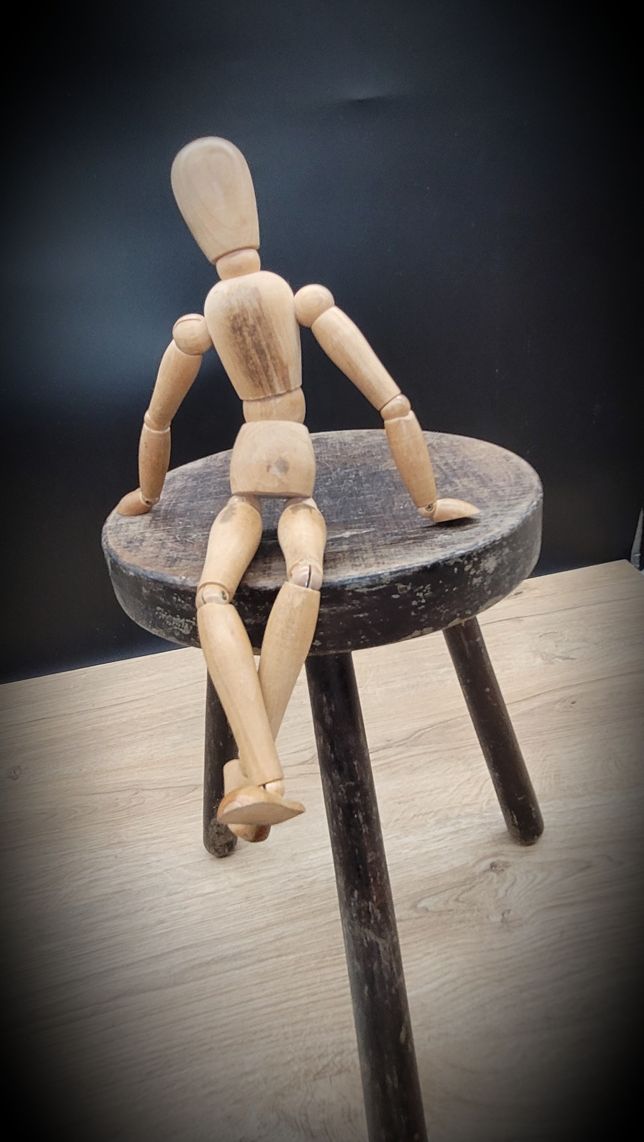 Massive black tripod stool