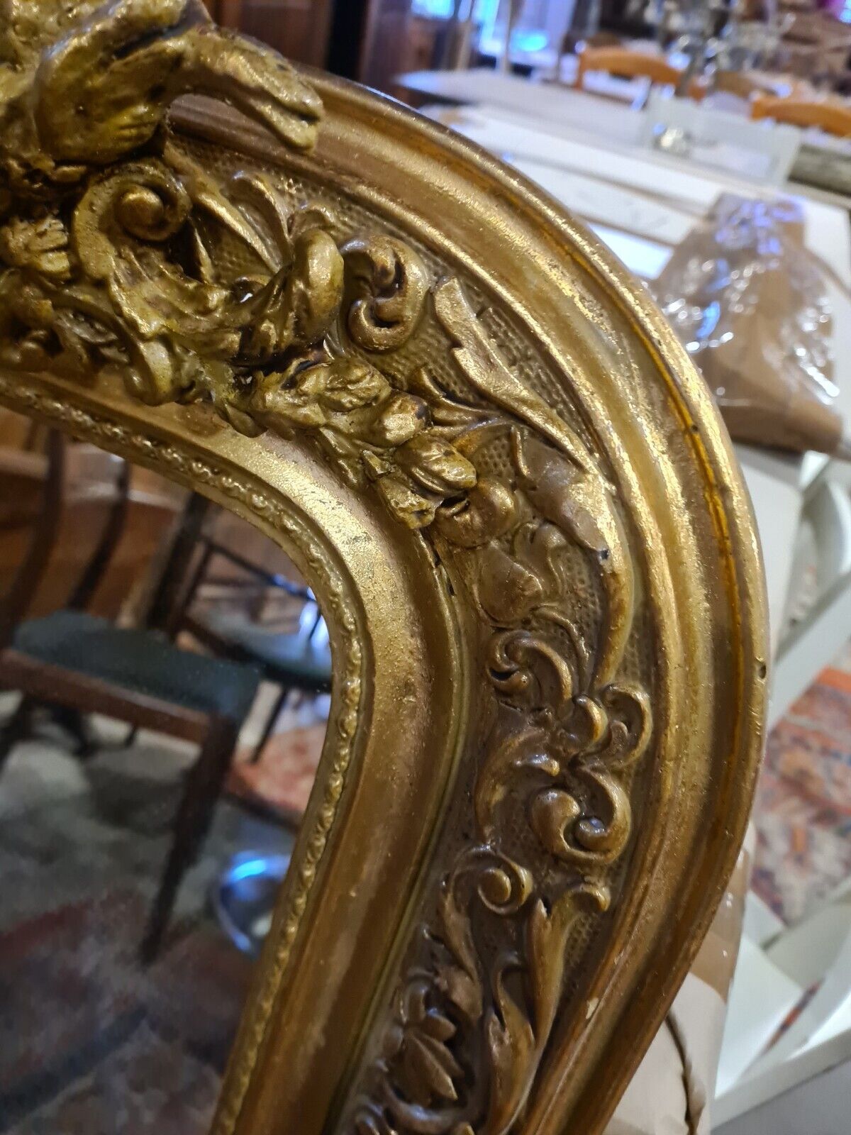 Golden mirror with a flute-playing angel