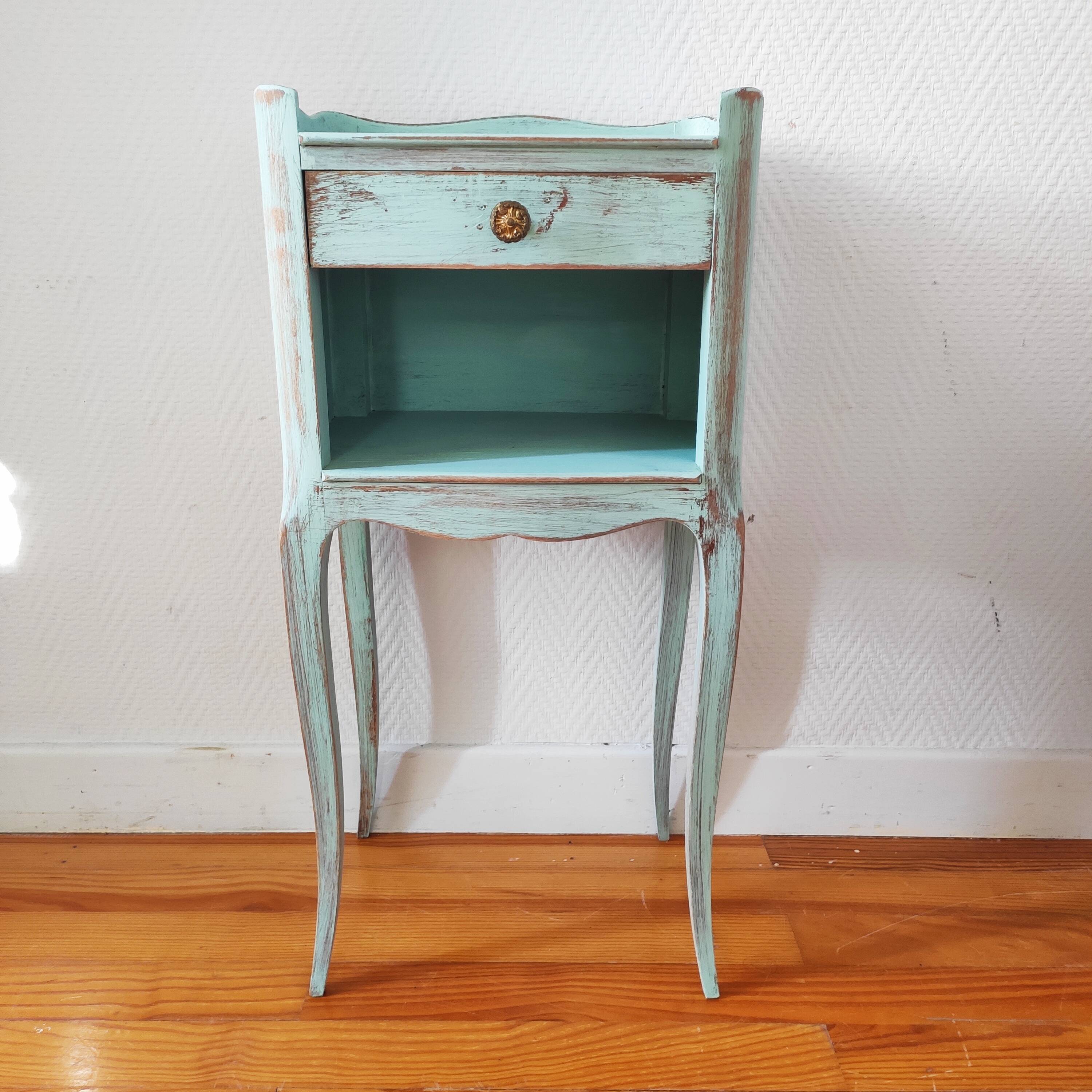 Patinated bedside table end of sofa