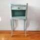 Patinated bedside table end of sofa