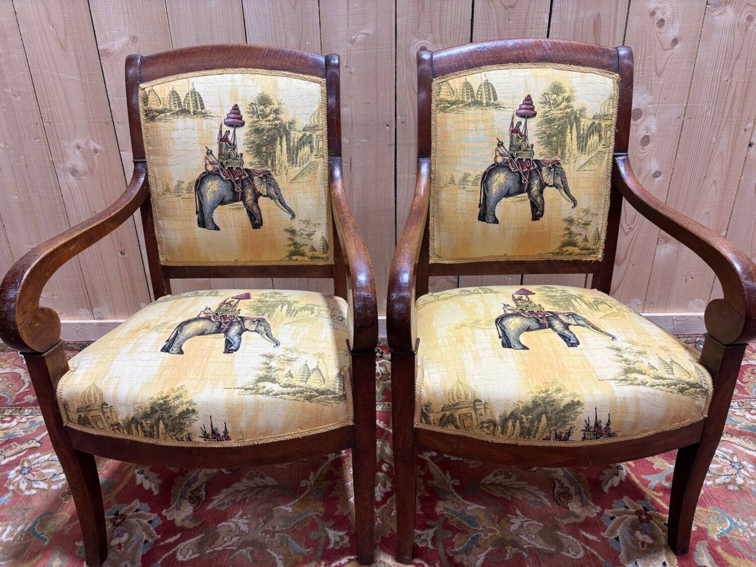 Pair of 19th-century armchairs with a scrolled back
