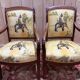 Pair of 19th-century armchairs with a scrolled back