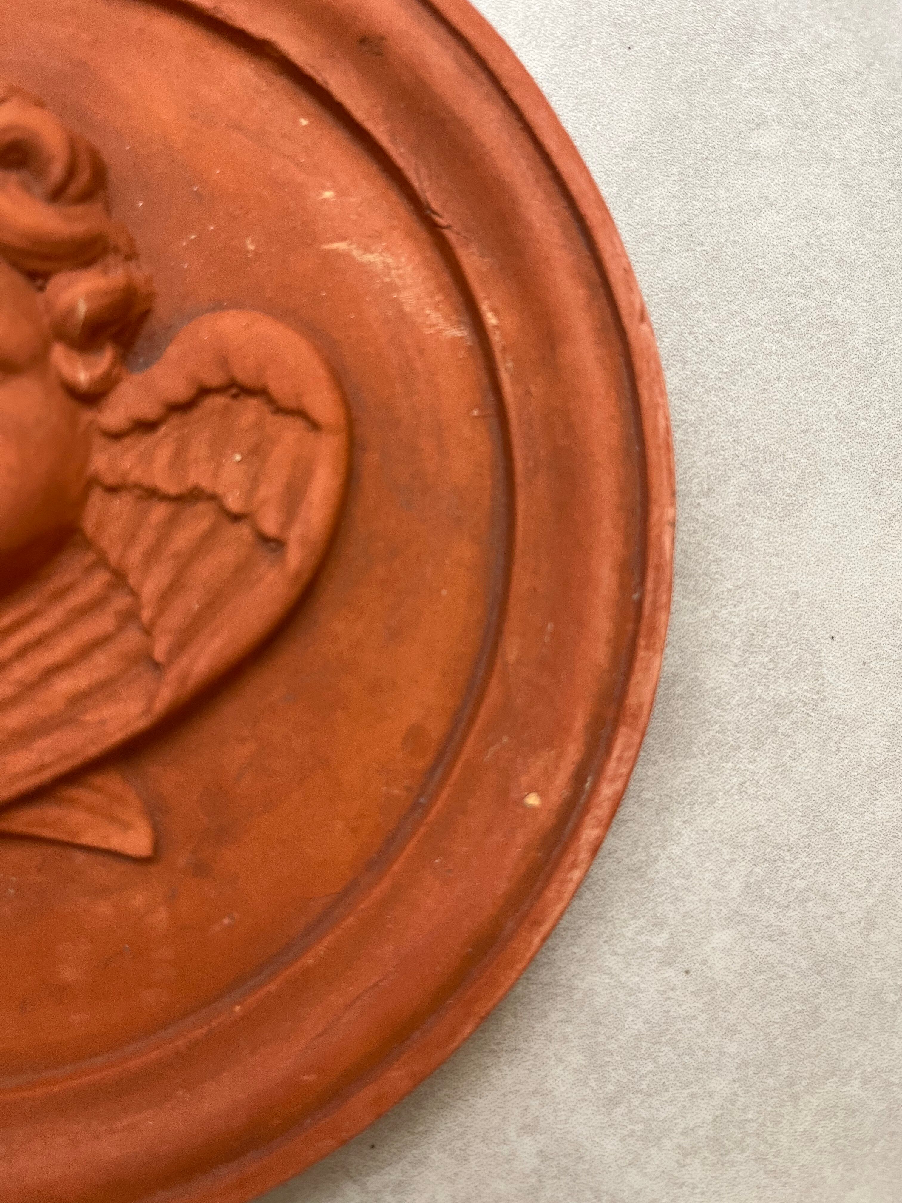 Hanging rondel "Cherub" terracotta