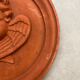 Hanging rondel "Cherub" terracotta