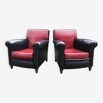 Duo de fauteuils club vintage en skaï rouge et noir