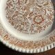 Set of 4 small dessert plates with a vintage stylised flower pattern.