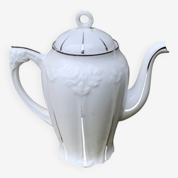 Porcelain coffee pot with floral pattern and silver stem