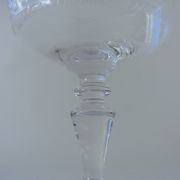 Suite of six champagne glasses on foot in engraved colorless crystal