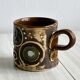 Tasse en céramique signé.