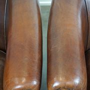 Set of two rugged sheep let of two rugged sheep leather club armchairs with a nice distressed look
