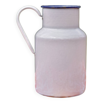 Old white enameled sheet metal milk jug