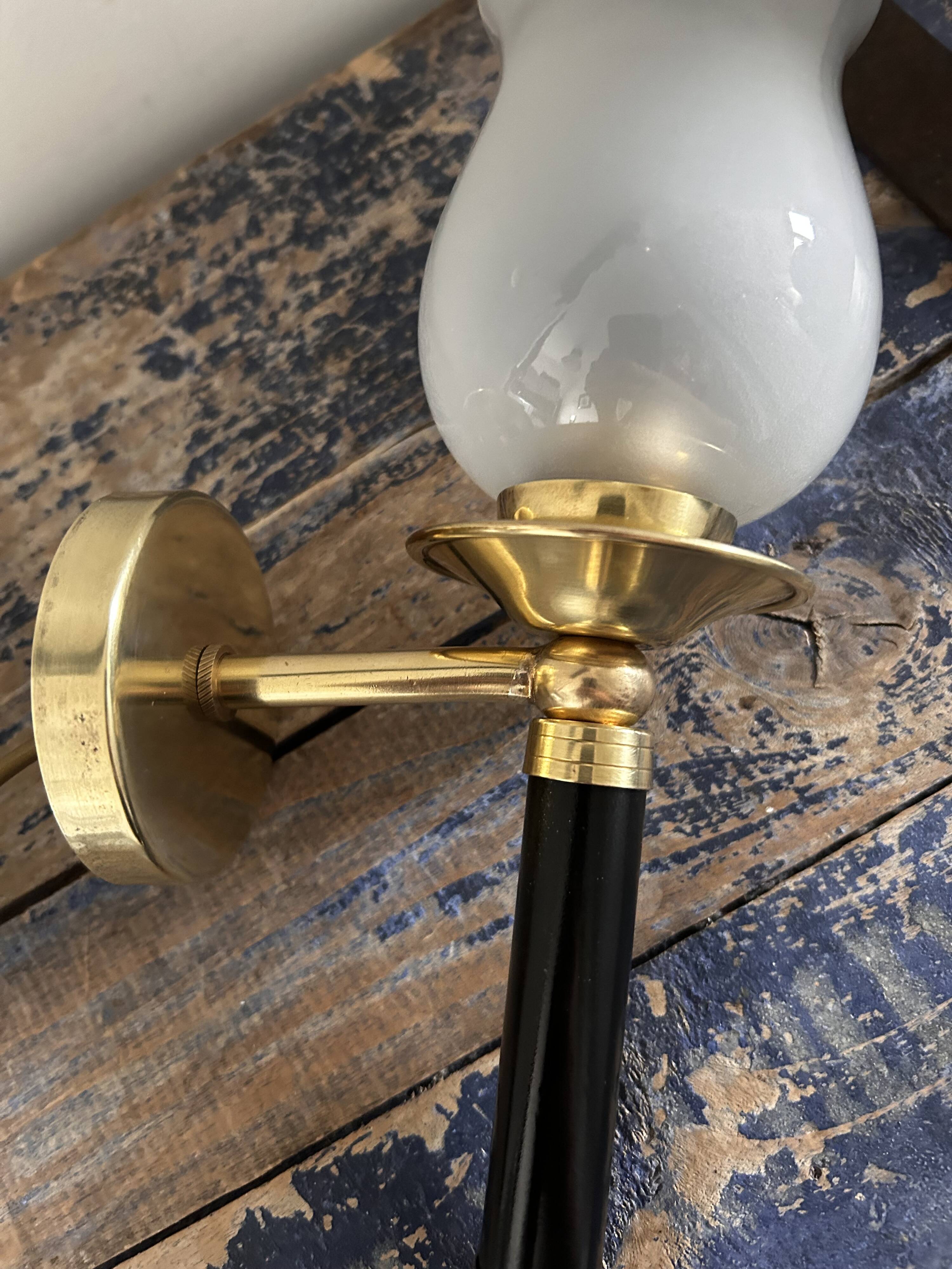 Pair of brass and black torchiere wall lights