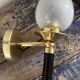 Pair of brass and black torchiere wall lights