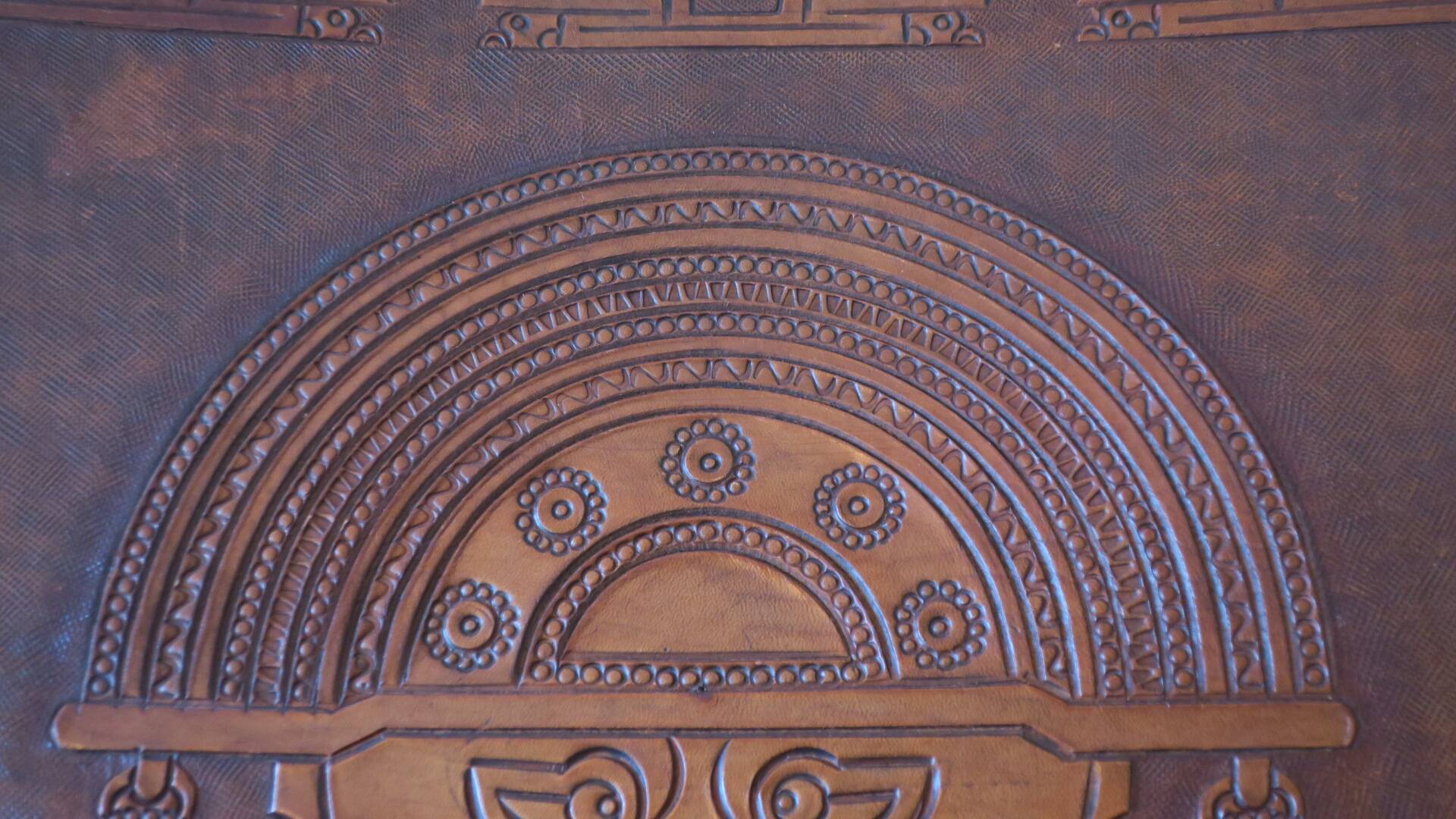 Tiahuanaco design tooled leather folding armchair by Angel Pazmino, Ecuador