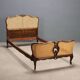 Simple bed in Barocchetto style in walnut.
