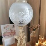 Table lamp, with globe cherub decoration