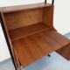 Vintage modular secretary bookshelf in teak and metal.
