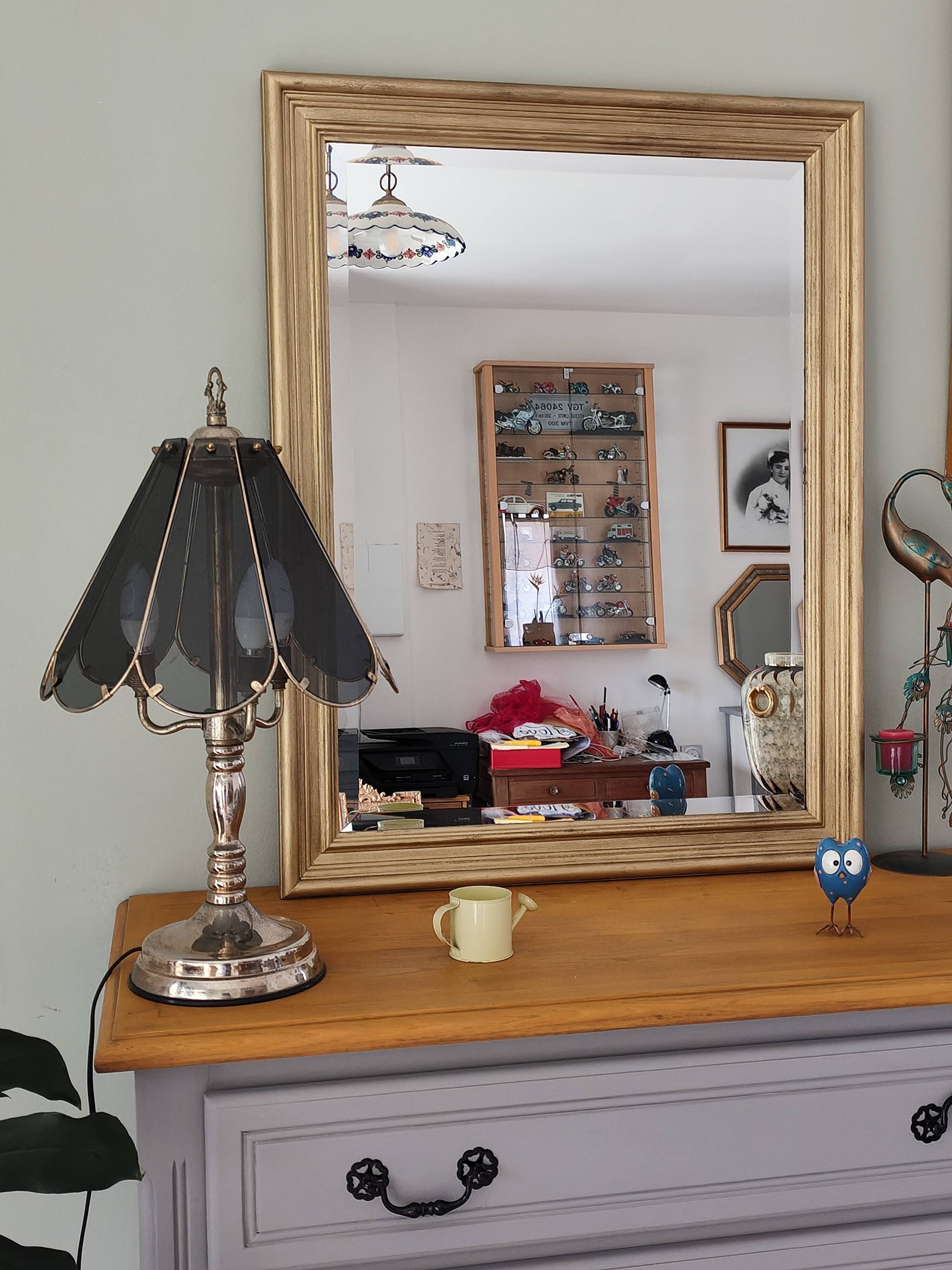 Large gold-framed mirror with bevelled glass.