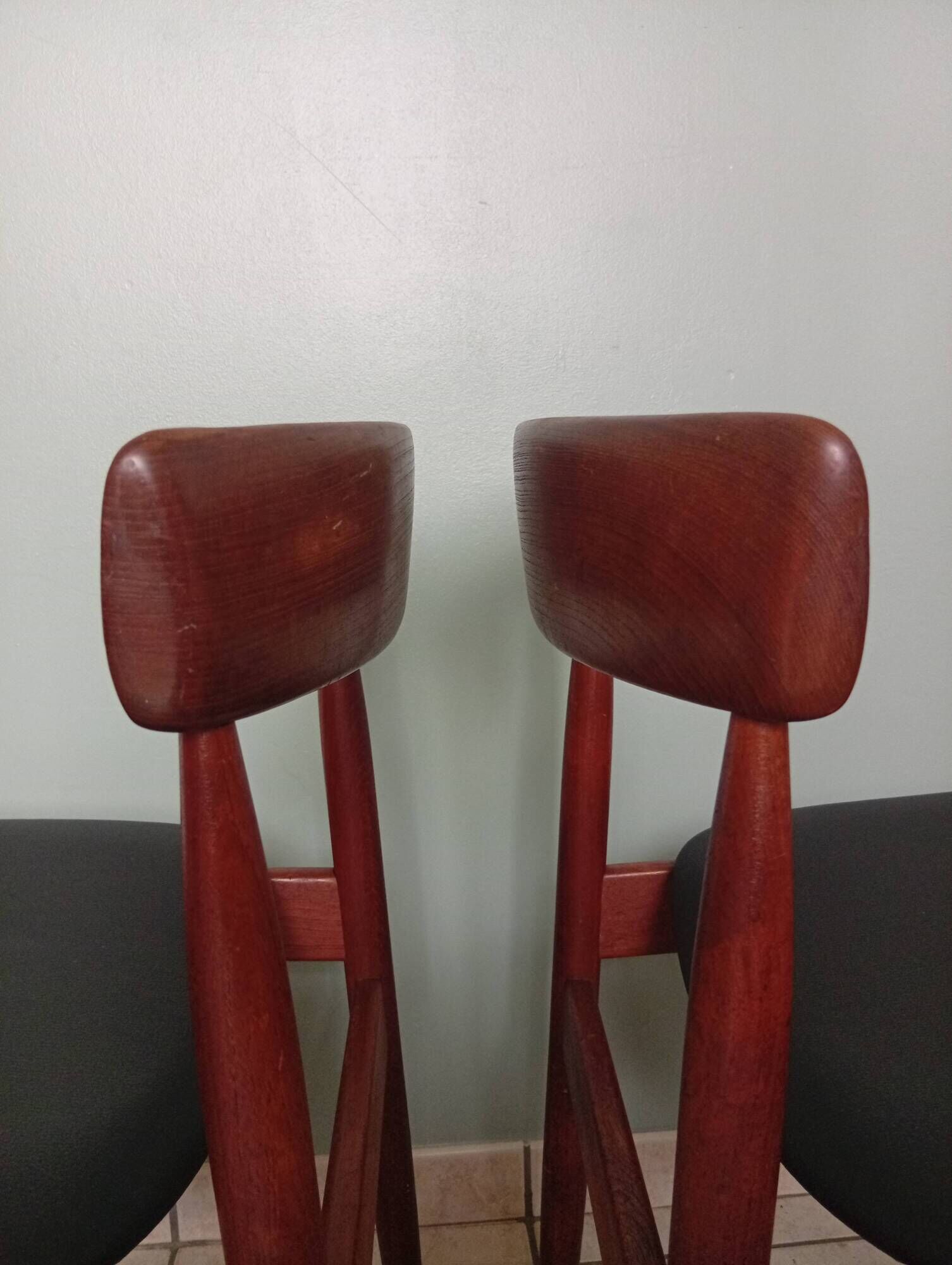 Four Danish mid-century teak armchairs.