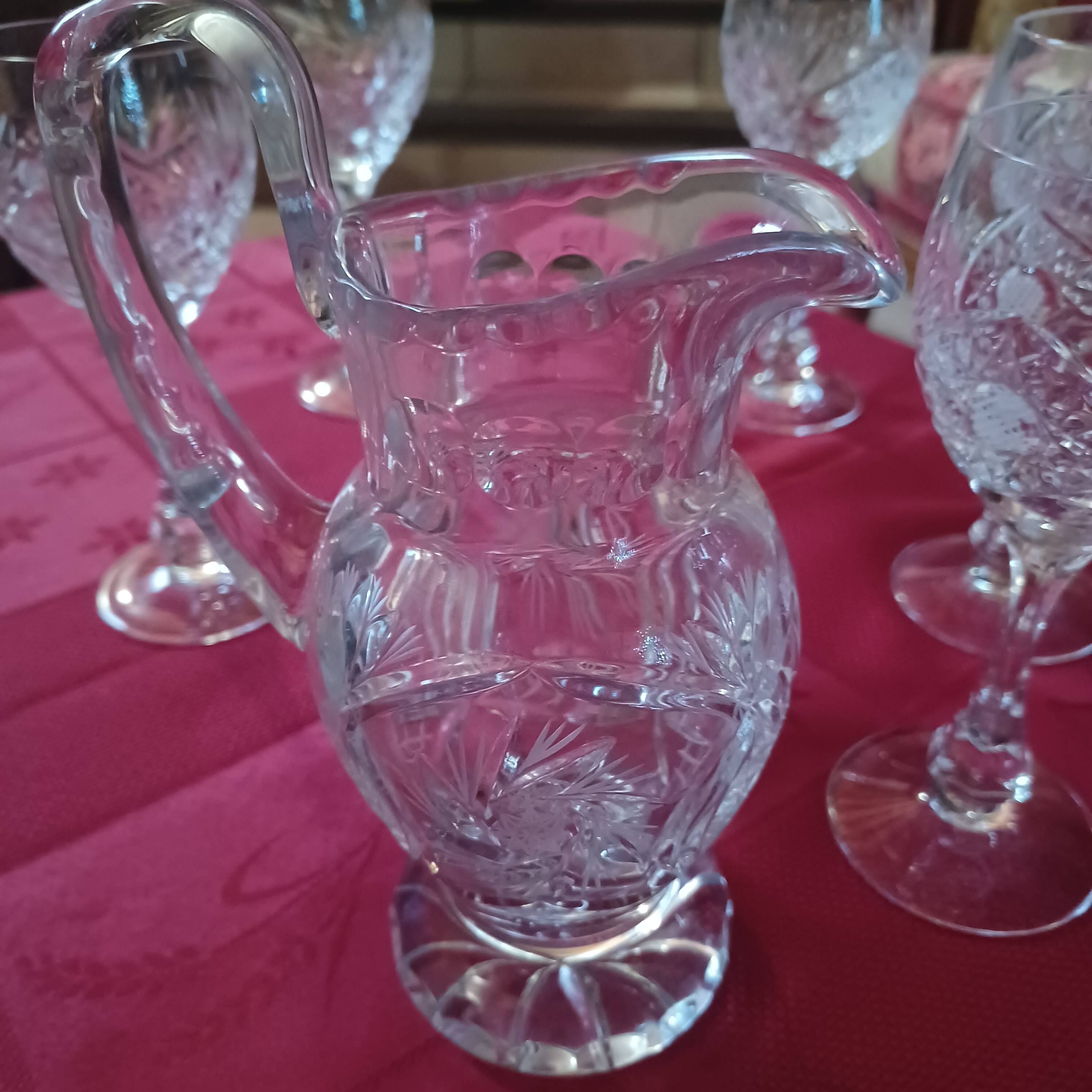 Crystal wine glasses cut by Baccarat with a jug.