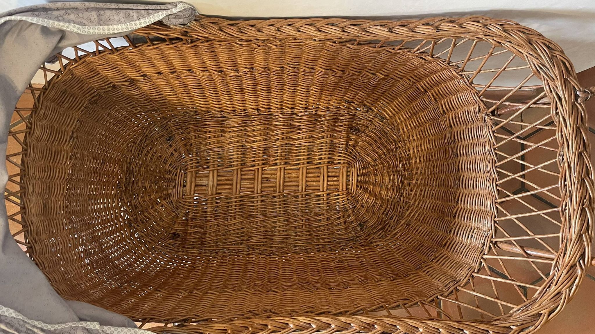 Antique rattan cradle in very good condition. Sold with or without upholstery.