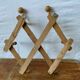 Wall accordion coat hanger