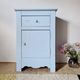 Handcrafted blue chest of drawers.