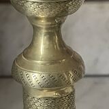 Pair of chiselled brass candlesticks from the 19th century.