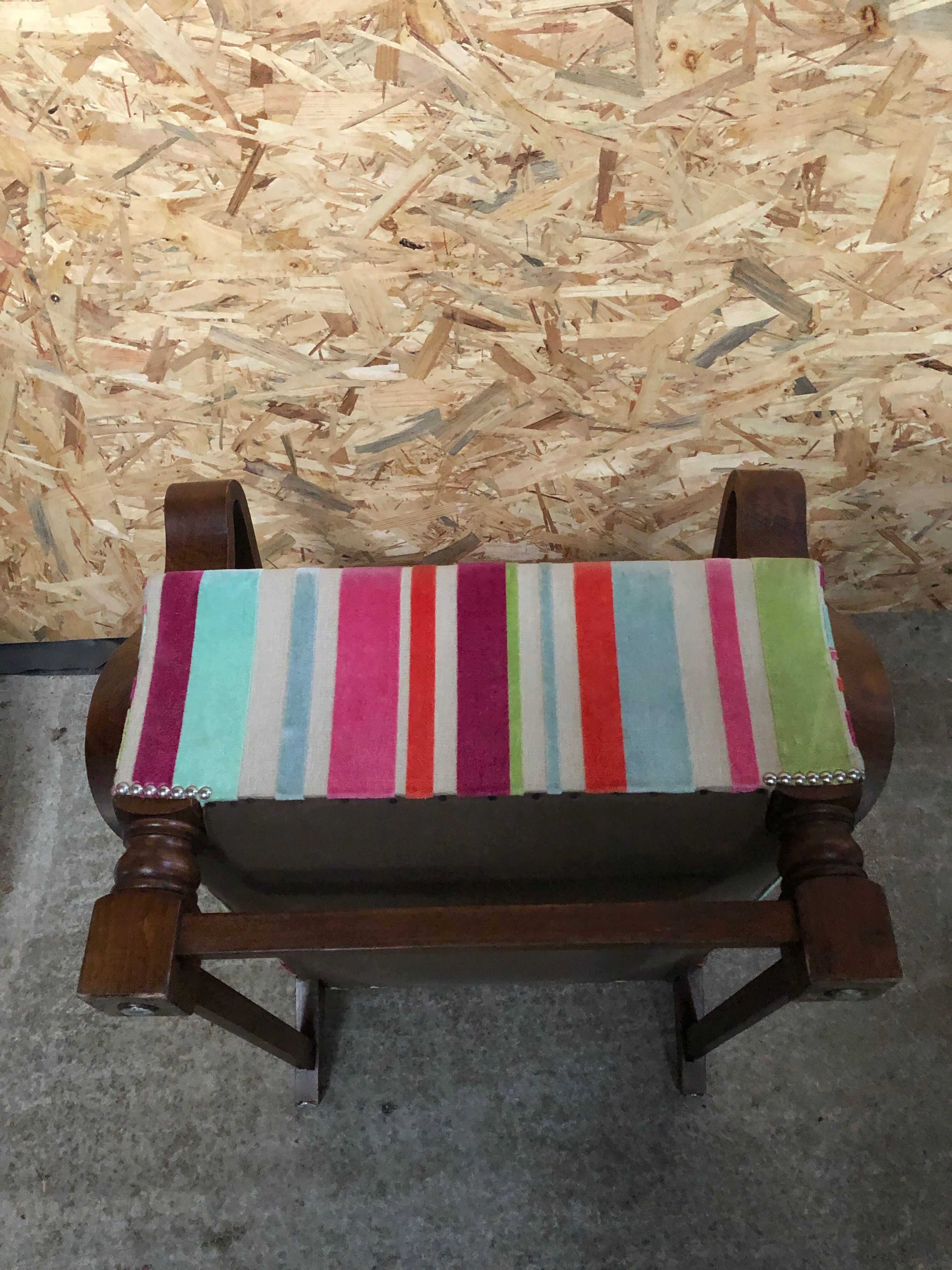 Old wooden armchair with curved armrests