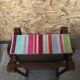 Old wooden armchair with curved armrests
