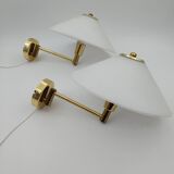 Pair of articulated arm wall lights in brass with opaline globe
