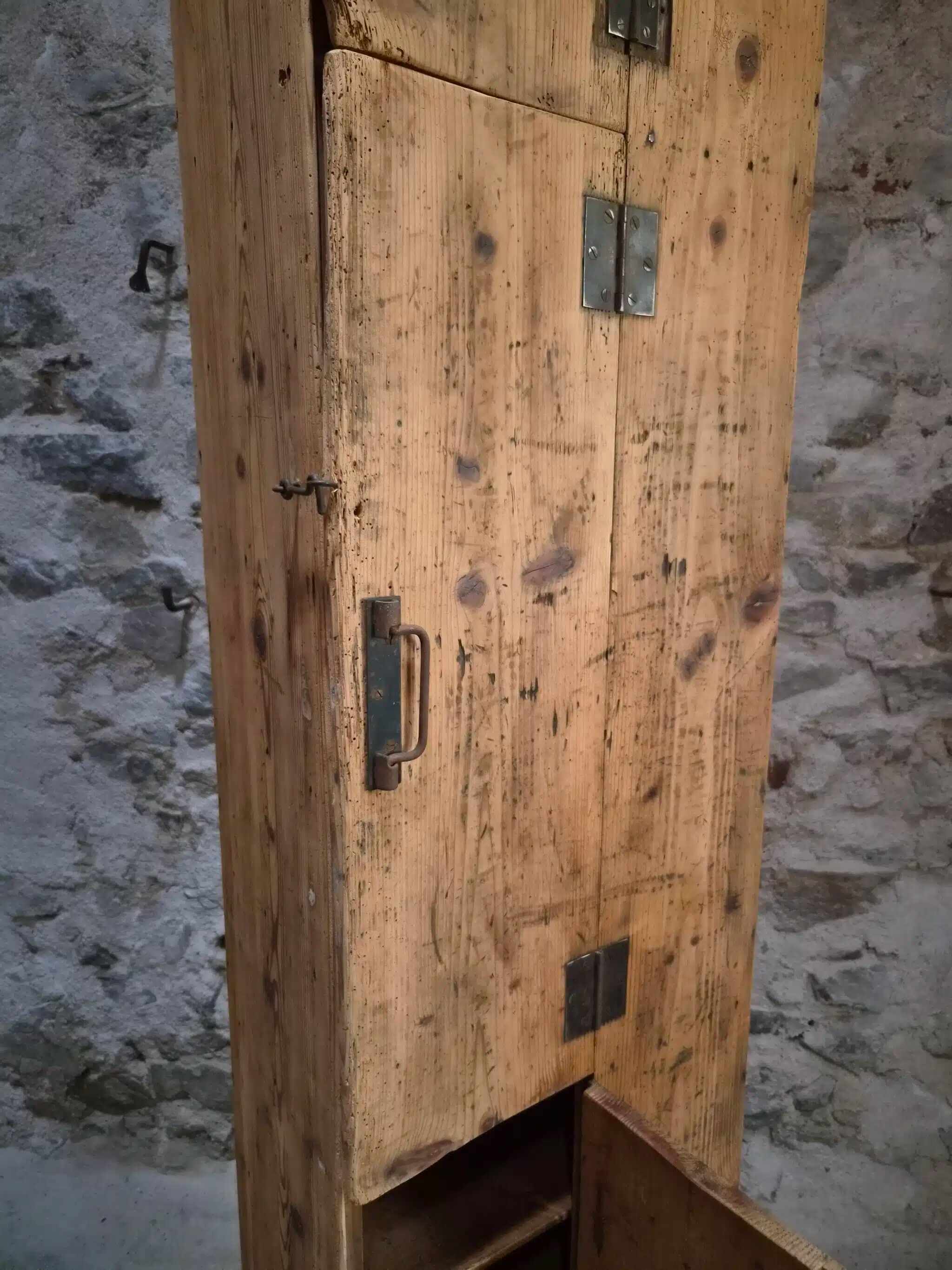 Antique French workshop cabinet in pine with compartments.