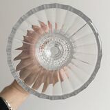 Antique thick glass vase on a pedestal.