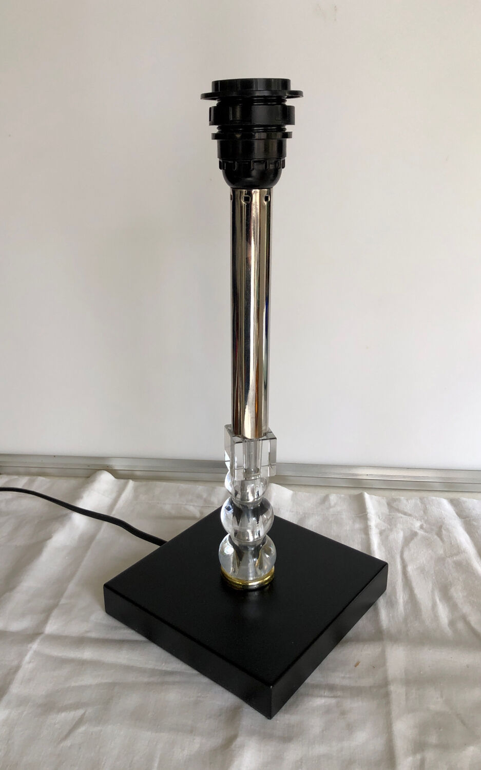 Silver floor lamp with a straight shade.