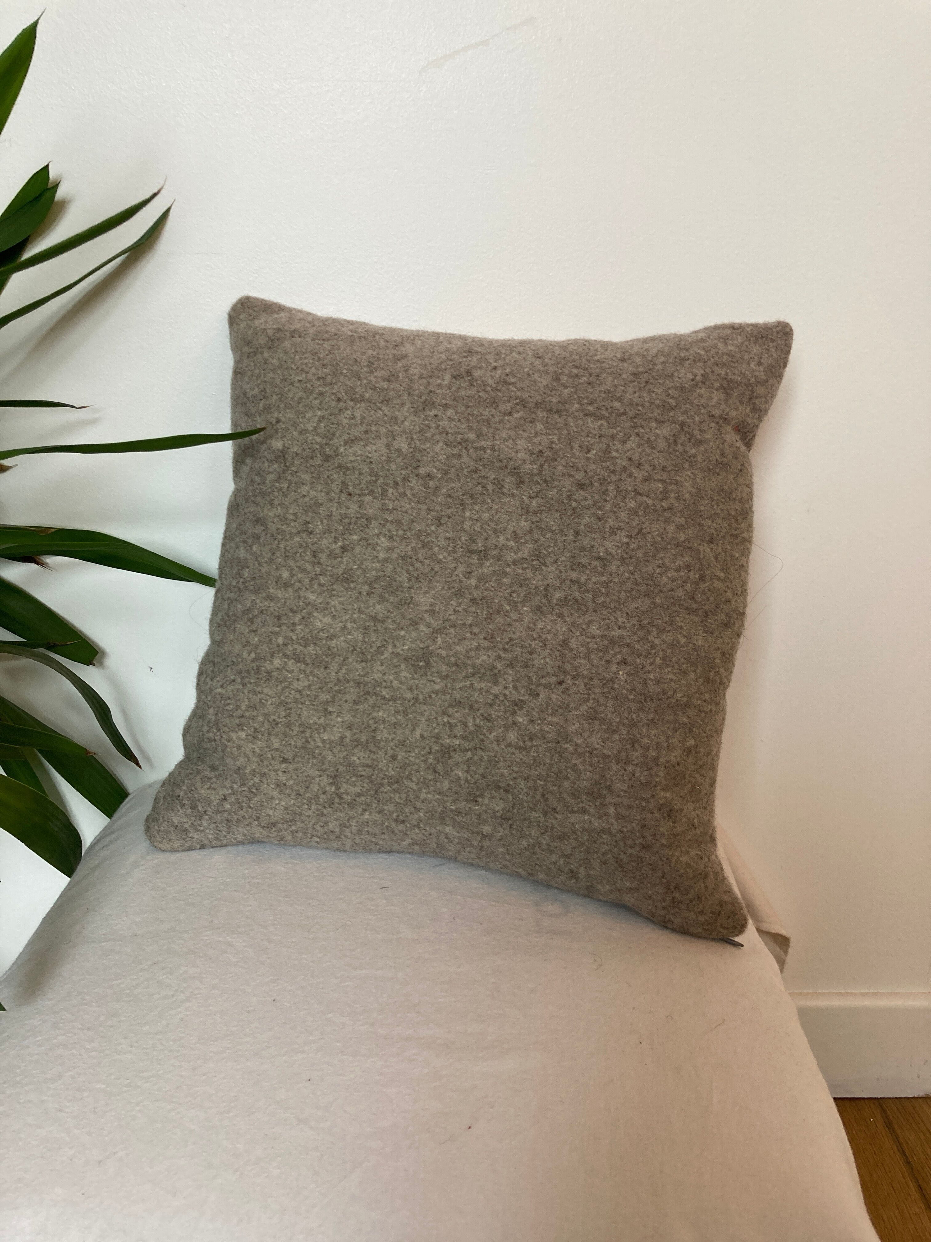 Bi-sided cushion gray wool yoke orange fabric