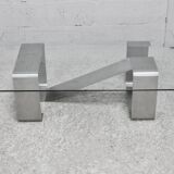 Coffee table with "kinetic" steel base and glass slab. Circa 1970.