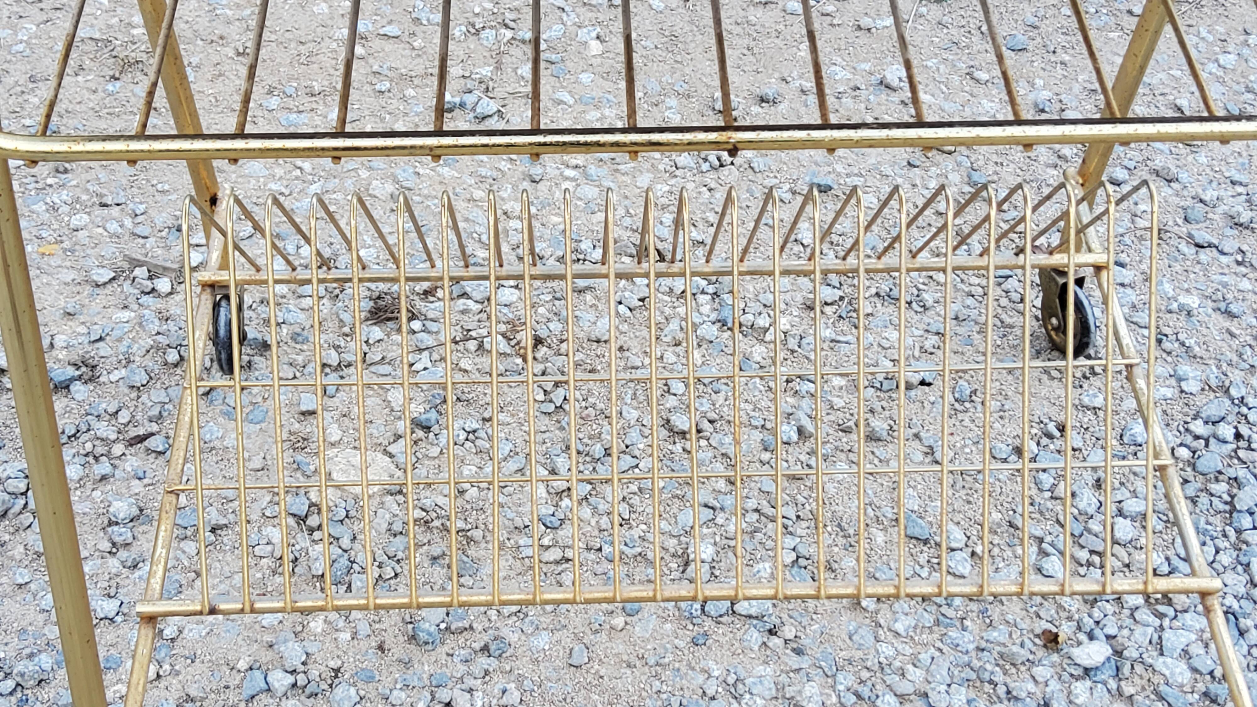 Side table of the 60s mahogany and gold metal range discs