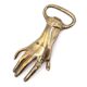 Brass hand bottle opener, 50s