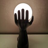 Italian design ceramic table lamp, two hands and glass shade.
