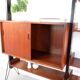 Vintage teak shelving system in 60s-70s style, retro style.