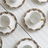 7 Limoges porcelain cups and saucers with gold decoration and floral motif.