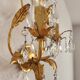 Hand-forged wall lamp gilded with gold leaf and crystals, Italy