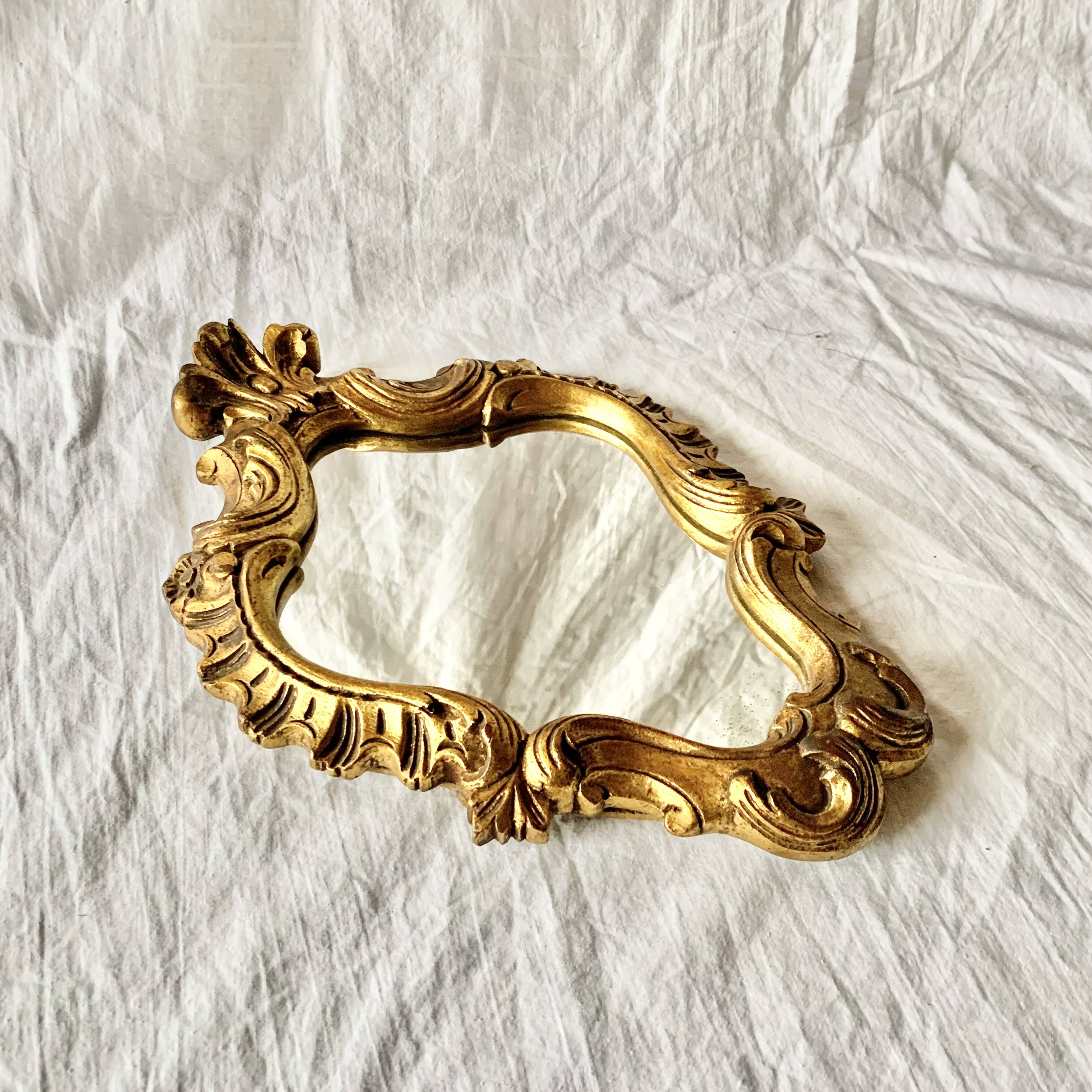Rococo wall mirror in golden resin