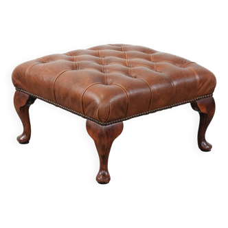 Elegant cowhide chesterfield ottoman