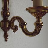 Simple wall sconce in classic Empire style in vintage French bronze.