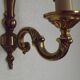 Simple wall sconce in classic Empire style in vintage French bronze.