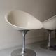 Ero swivel armchair in metal and white shell, p. starck design for kartell