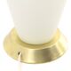 Table lamp in opaline glass and brass with a parchment shade, 1950s.