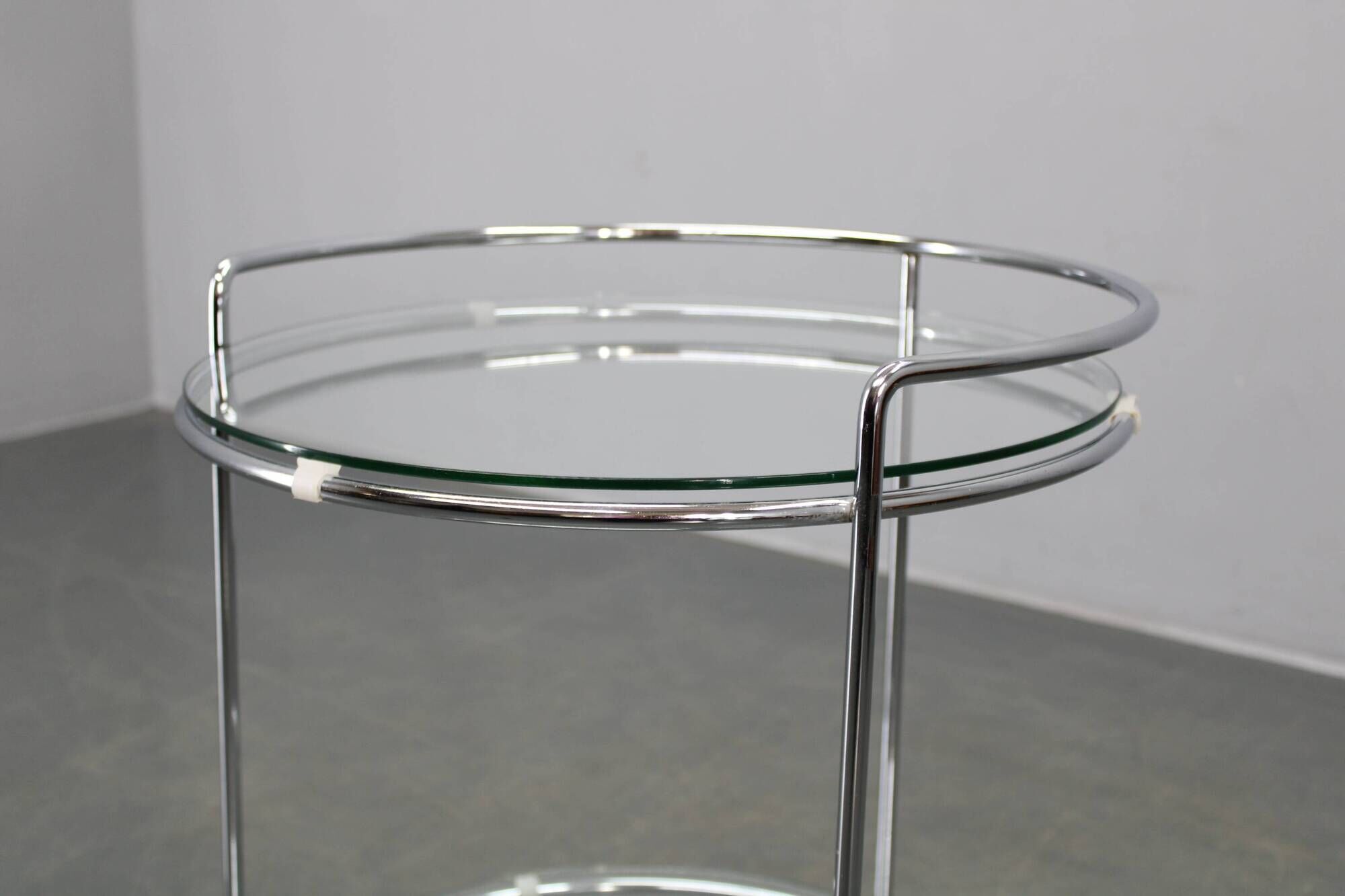 Mid-century round serving table, chrome and glass, Italy, 1980s