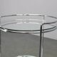 Mid-century round serving table, chrome and glass, Italy, 1980s